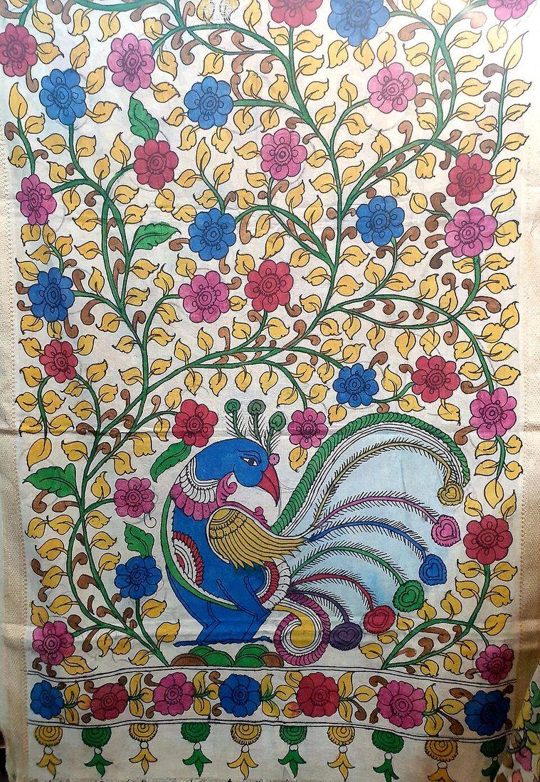 A colourful Kalamkari painting with a peacock and flowering vines