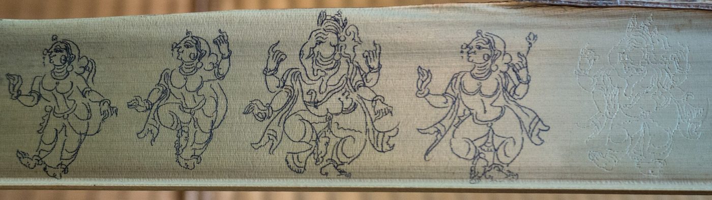 A long pattachitra scroll with line-drawn figures