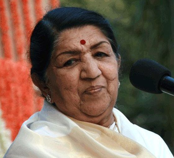 Lata Mangeshkar at a microphone