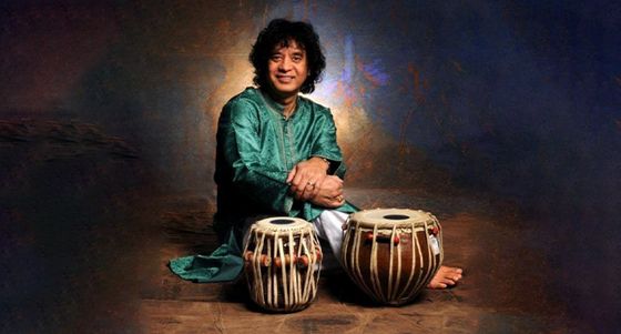 Ustad Zakir Hussain seated at the tabla