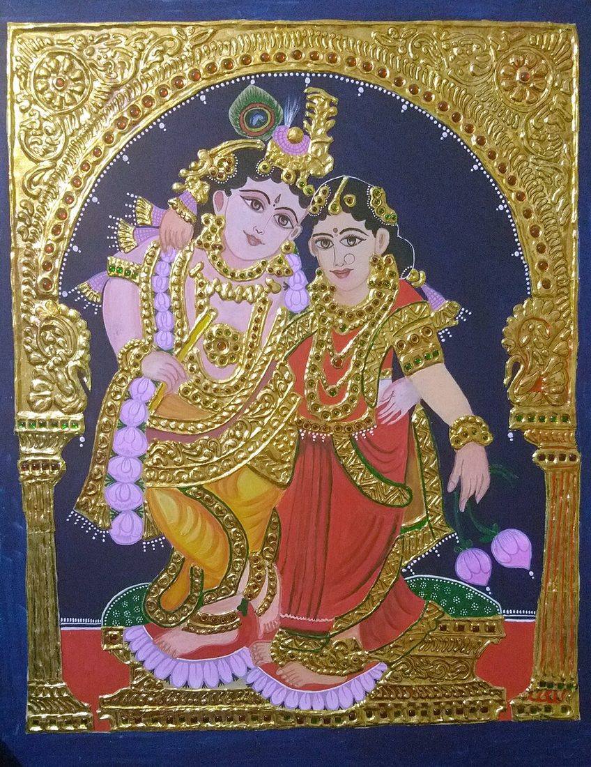 A Thanjavur painting of Radha and Krishna with gilded relief work